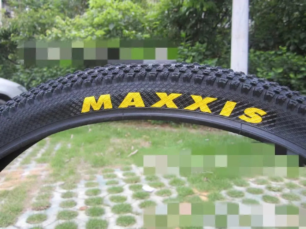 Mountain bike tyre showing tread pattern and sidewall with size markings