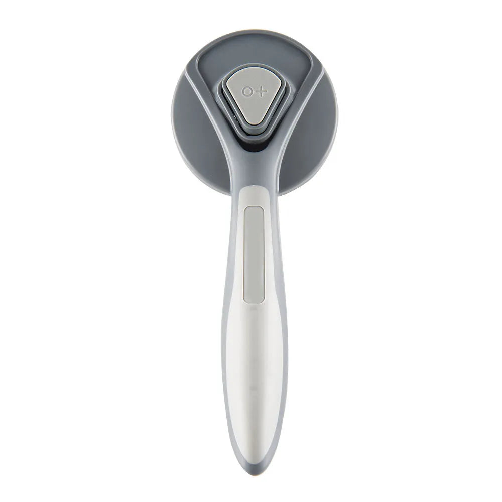 Self-cleaning slicker brush for cats and dogs in grey, green, or pink with massage bristles and comfort-grip handle