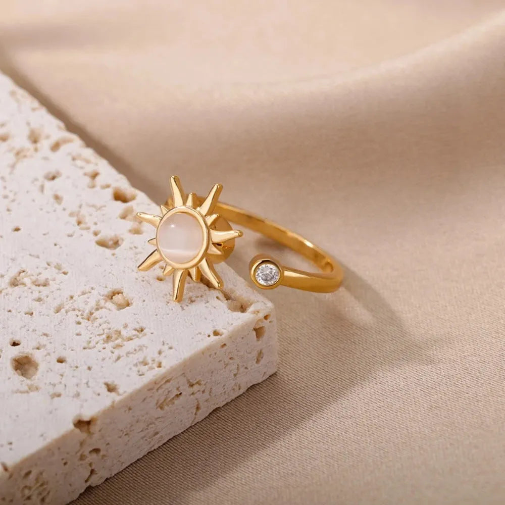 Simple geometric gold adjustable fidget ring with rotating band on a finger