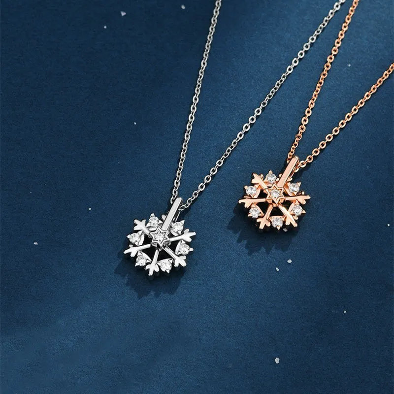 Rotatable S925 silver snowflake necklace for women with rhinestone detail, available in rose gold or white gold.