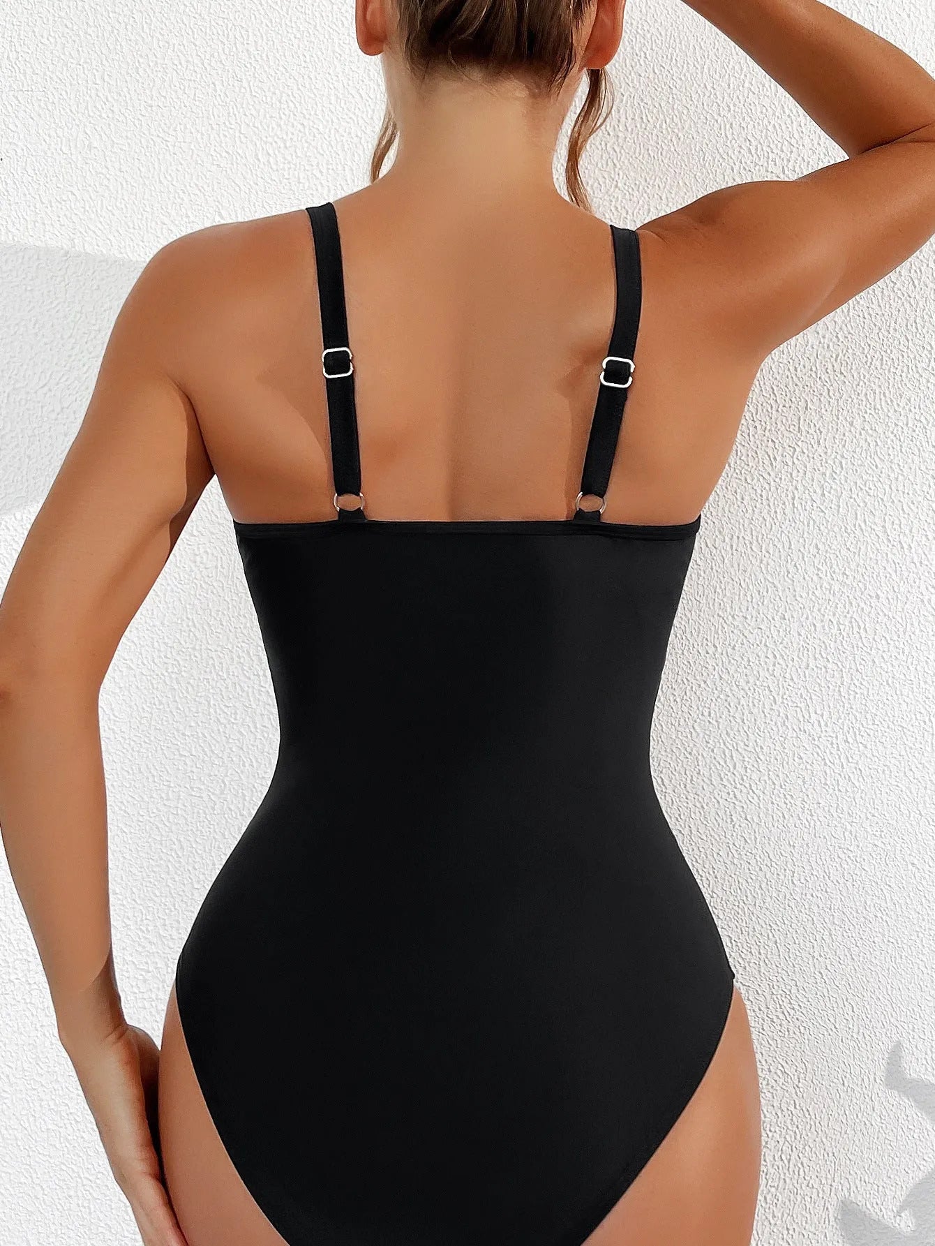 Black women's one-piece swimsuit with a mesh halter neck and brief-style legs.