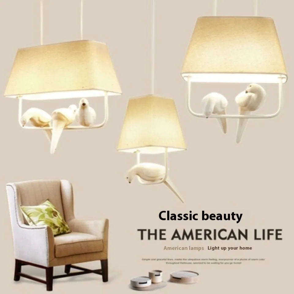 Iron droplight bird chandelier ceiling lamp with a decorative fabric shade featuring bird designs.