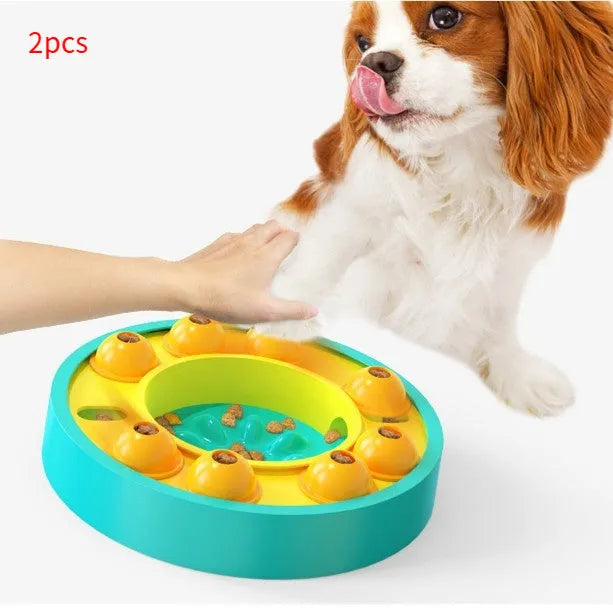 Square green interactive dog puzzle feeder bowl with central column and top turntable on a non-slip base.