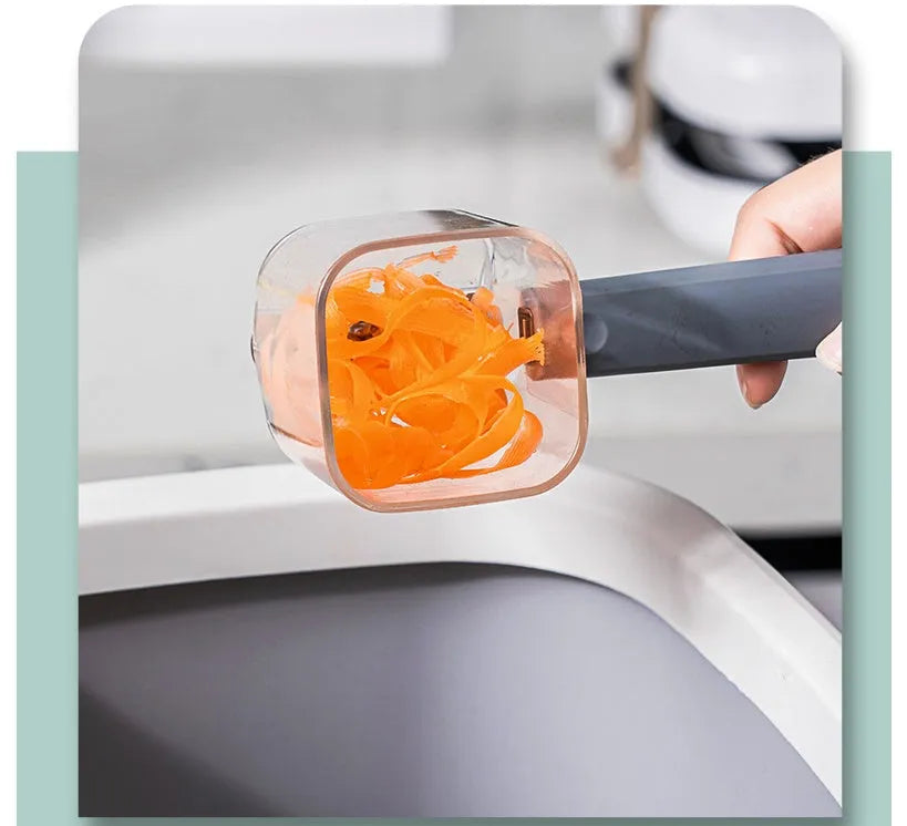 Creative stainless steel kitchen peeler with a coloured PP handle on a white background.