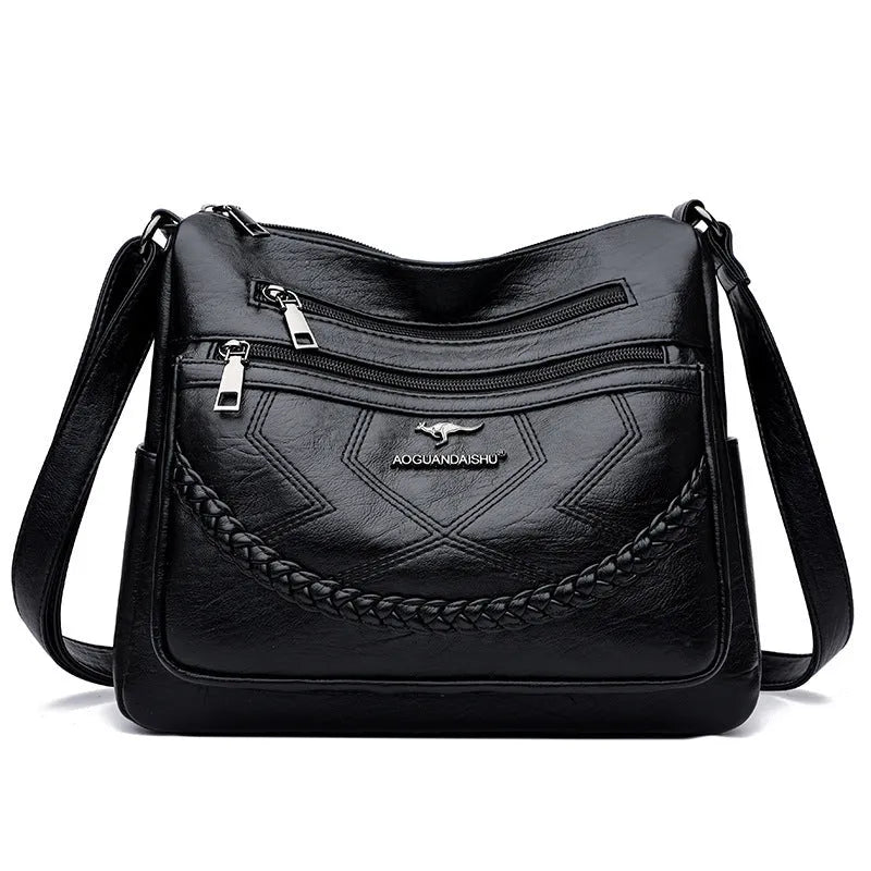 Black soft PU leather shoulder bag with crossbody strap, showing 30cm width and zippered internal organiser