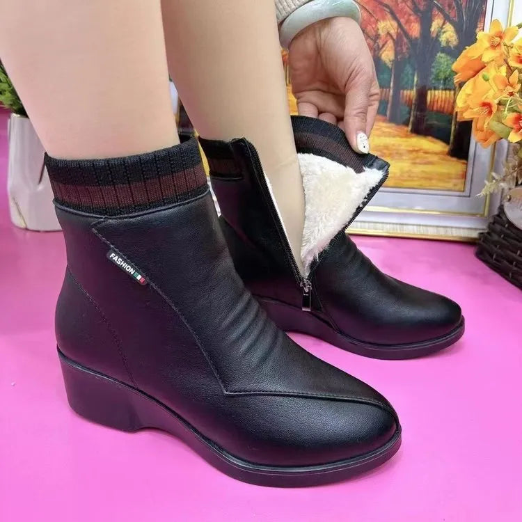 Pair of women's mid heel square heel ankle boots with side zipper and artificial plush lining in black or red