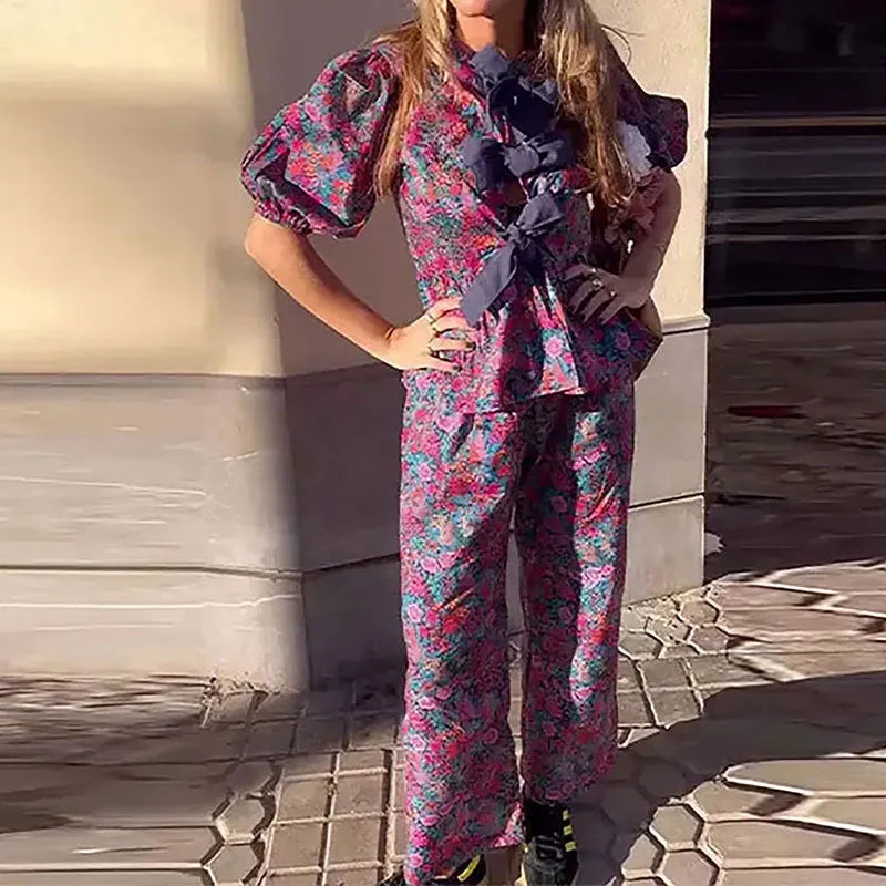 Floral print trousers suit with puff sleeves on top and matching trousers, shown in picture colour