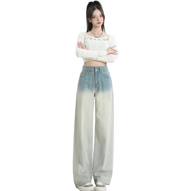 Women's gradient blue straight-leg denim trousers showing colour transition and straight cut silhouette