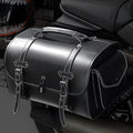 Dark punk motorcycle tail bag with coded lock mounted on cruiser motorcycle