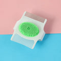 Blue and green handheld multifunctional dog grooming comb for hair removal and massage