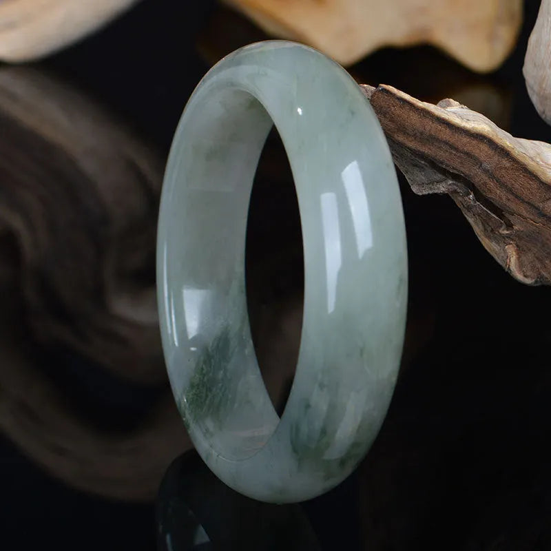Natural Jinsi Jade Chinese-style bracelet shown in various sizes from 52mm to 62mm inner diameter.