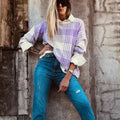 Lilac plaid print loose sweater with ribbed trim and long sleeves, shown in a relaxed fit.