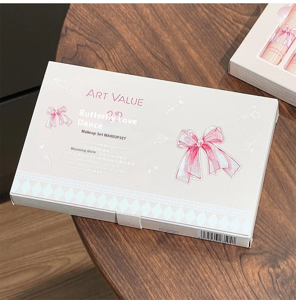 Butterfly Box make-up set with pink matte lip mud, blusher, and necklace.
