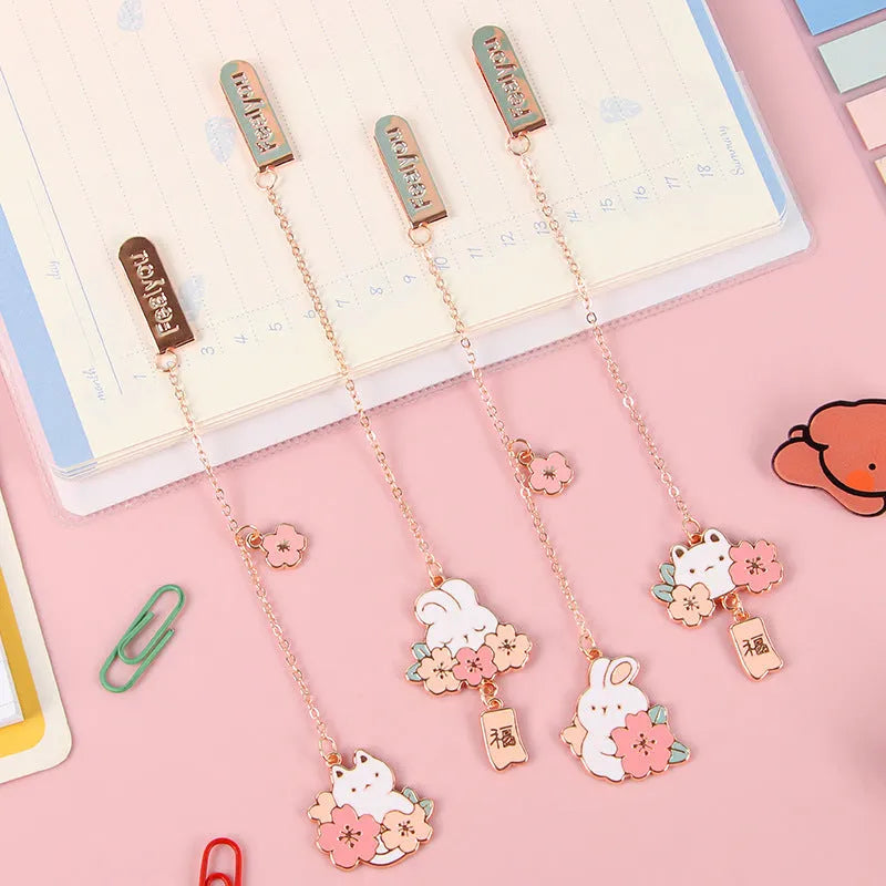 Creative cartoon metal pendant book holder with cherry blossom cat design for journal decoration.