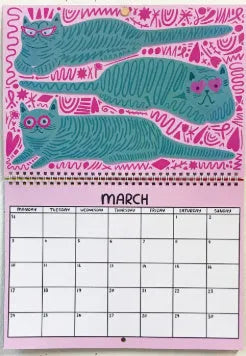 Cat-themed wall calendar showing 12-month grid with tear-off design and feline illustrations for each month