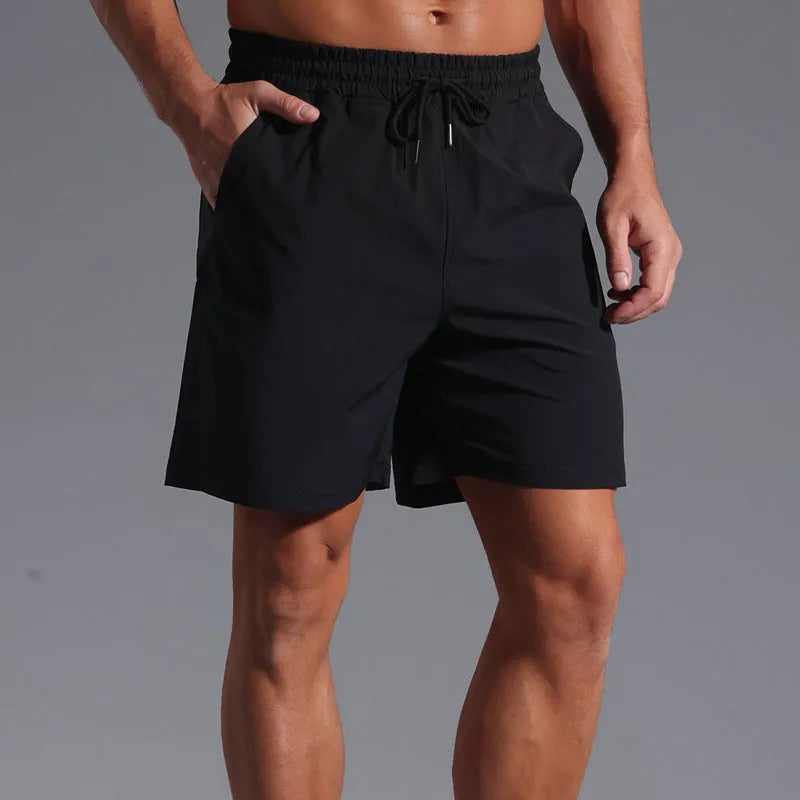 Man wearing loose khaki casual shorts made from quick-dry polyester fabric.