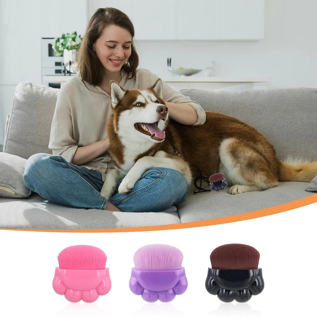 Set of three paw-shaped pet balm brushes with individual plastic storage boxes.