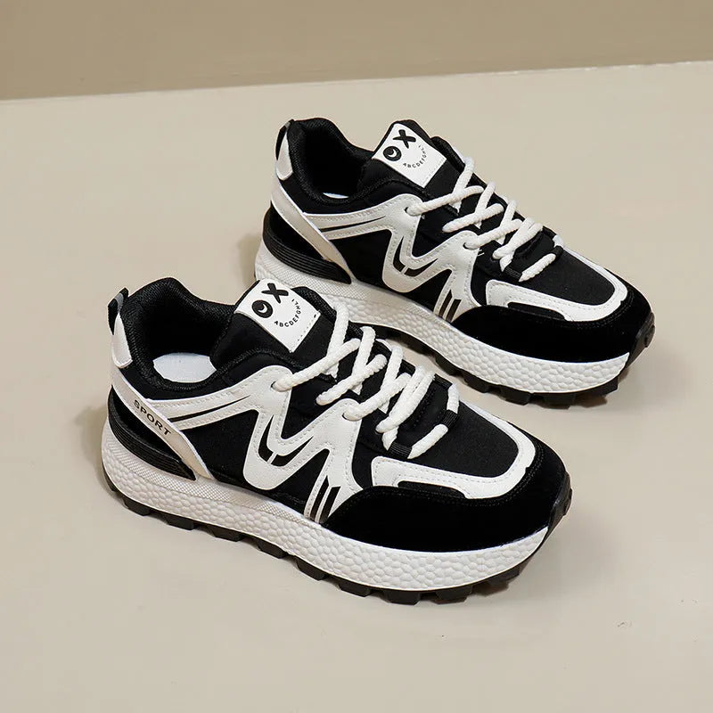 Women's grey casual lace-up shoes with round toe and flat heel on a white background.