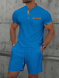 Men's grey waffle texture short sleeve suit with polo collar and matching shorts on hanger