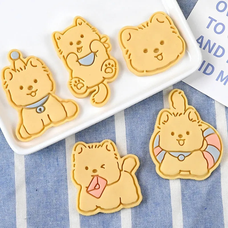 Three-dimensional press mould for creating puppy-shaped biscuits with seven design options including birthday hats