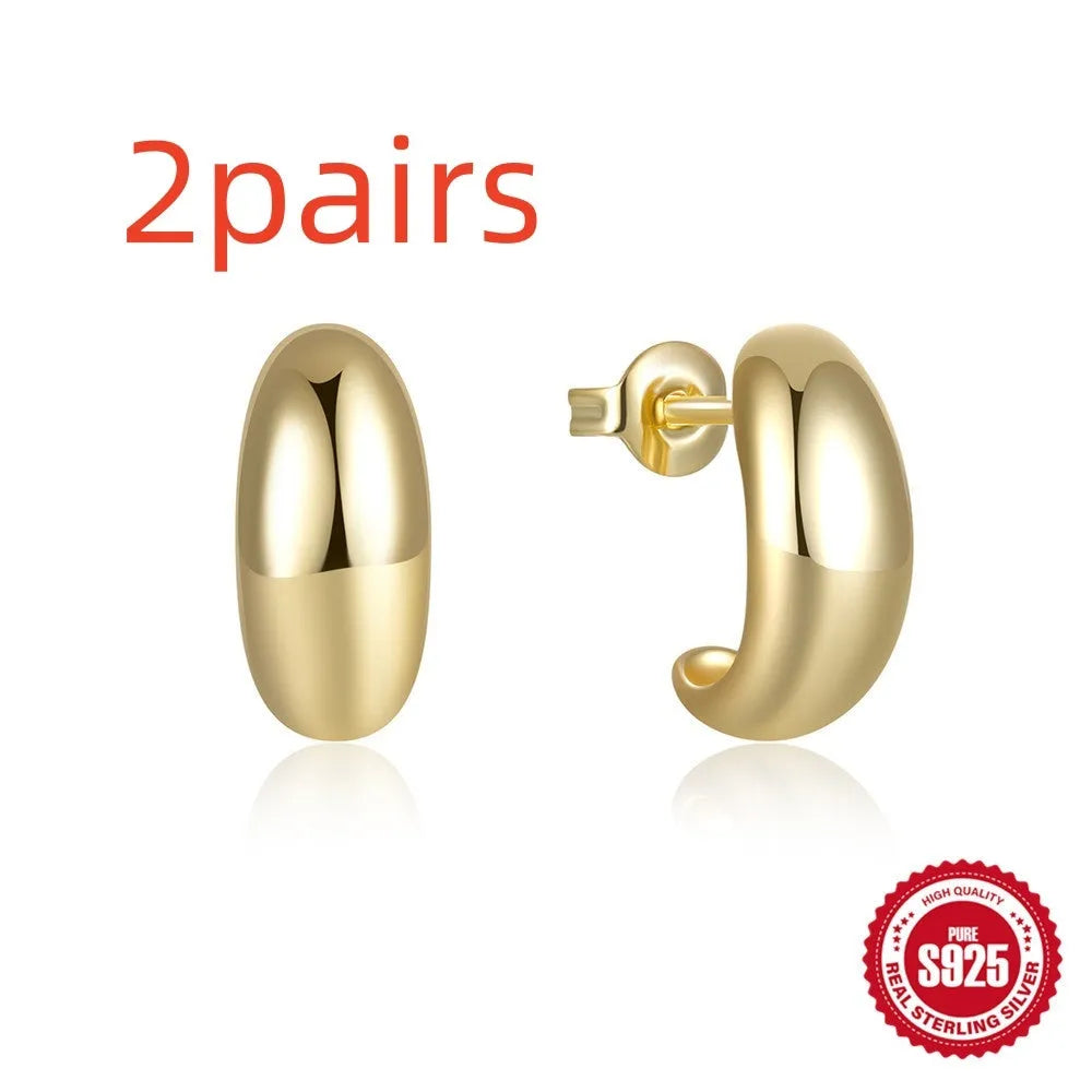 C-shaped sterling silver stud earring with glossy electroplated finish in gold or white gold colour