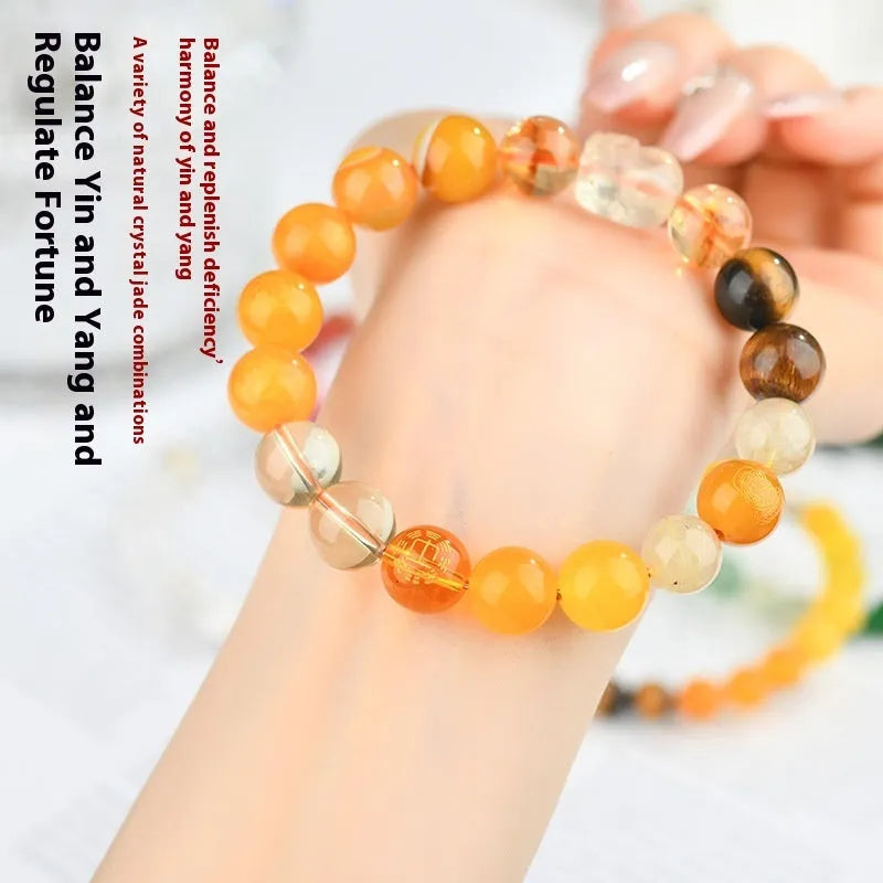Handmade five elements crystal bracelet showing geometric beads in gold, wood, water, fire, or earth colours.