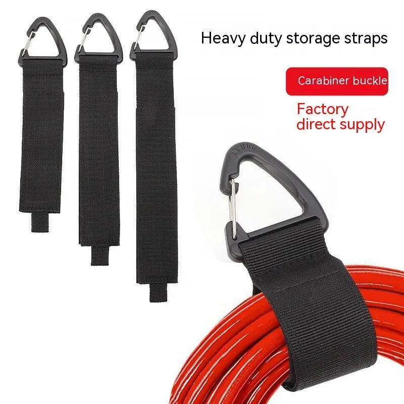 Black gravity storage strap with metal carabiner hook for workshop and camper organisation