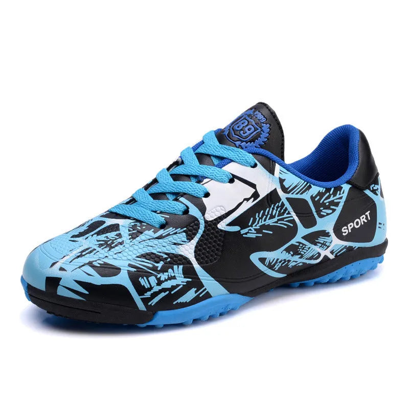 Low-top soccer shoes with synthetic leather upper, mesh lining, TPR sole, natural rubber outsole, in red, blue, or fluorescent green.