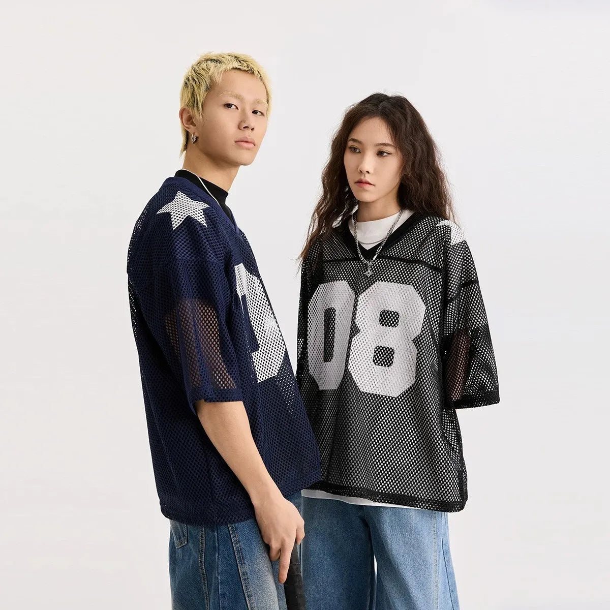 Half sleeve shirt pullover in black with letters pattern, loose fit on model