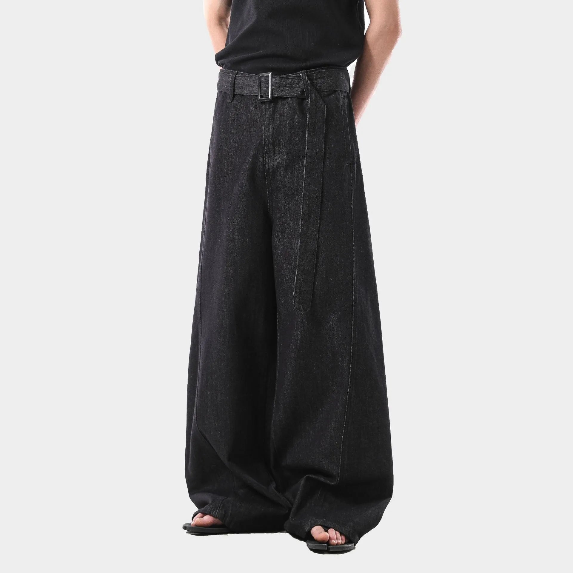 Black high waist straight leg jeans with zip placket fly, shown on model demonstrating fit and silhouette