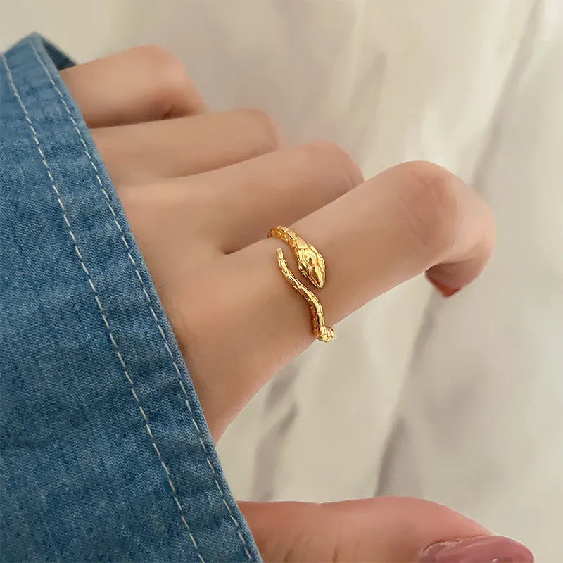 Open snake ring with textured copper band, electroplated in platinum or gold colour