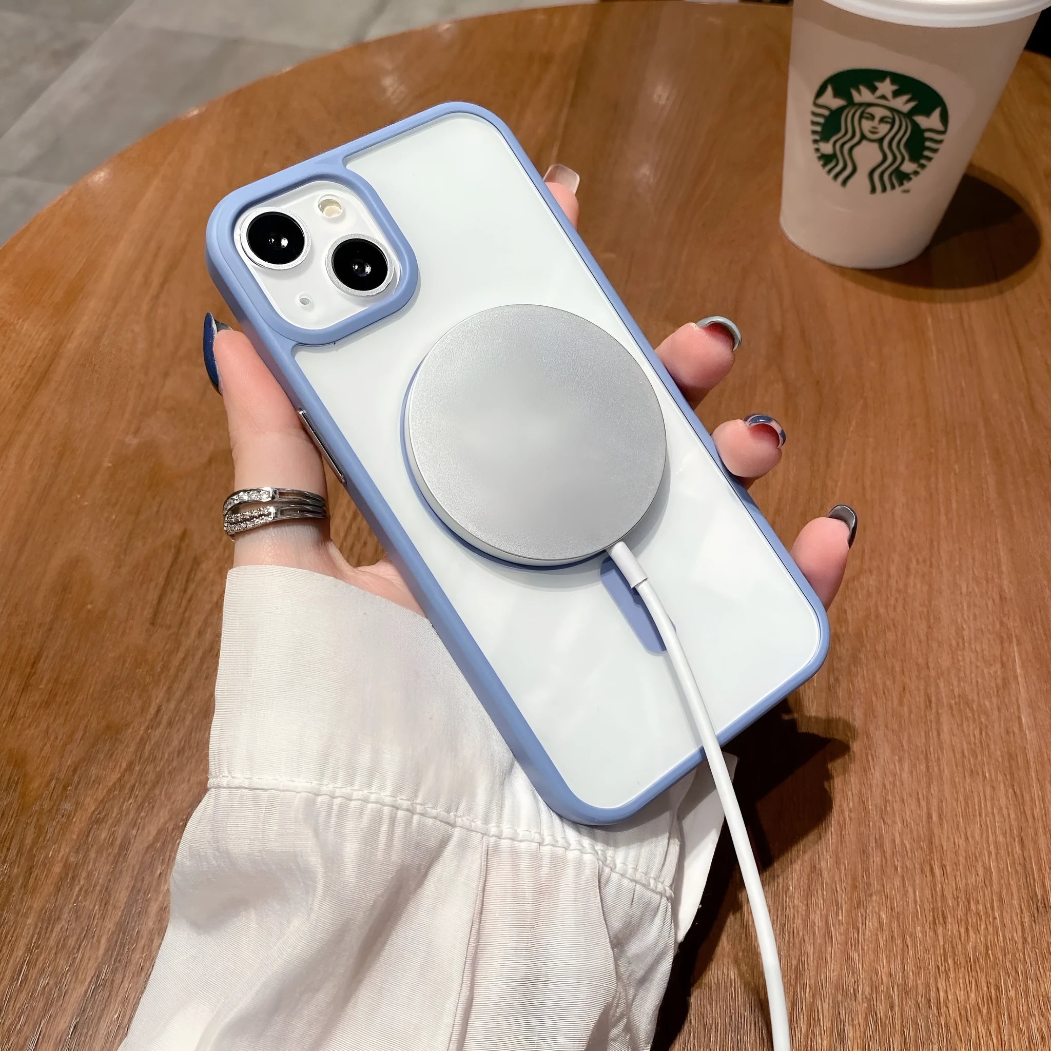 Transparent acrylic MagSafe phone case for iPhone with visible magnetic ring and TPU frame