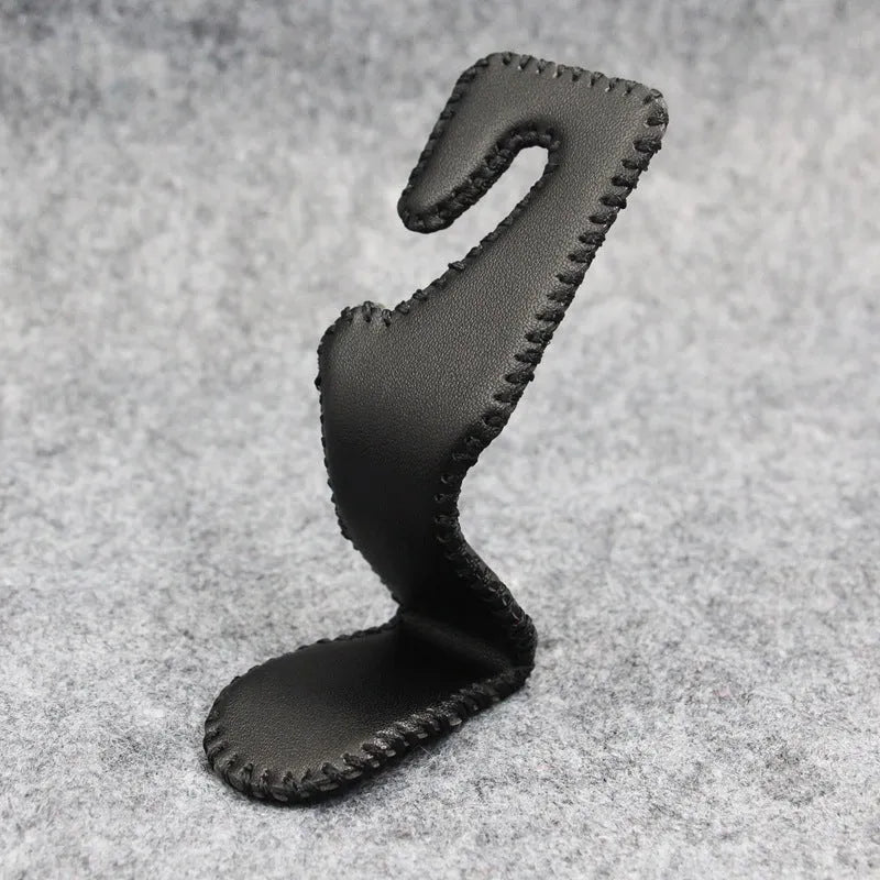 Gold-coloured stainless steel car seat back hook for organising bags on vehicle headrests.