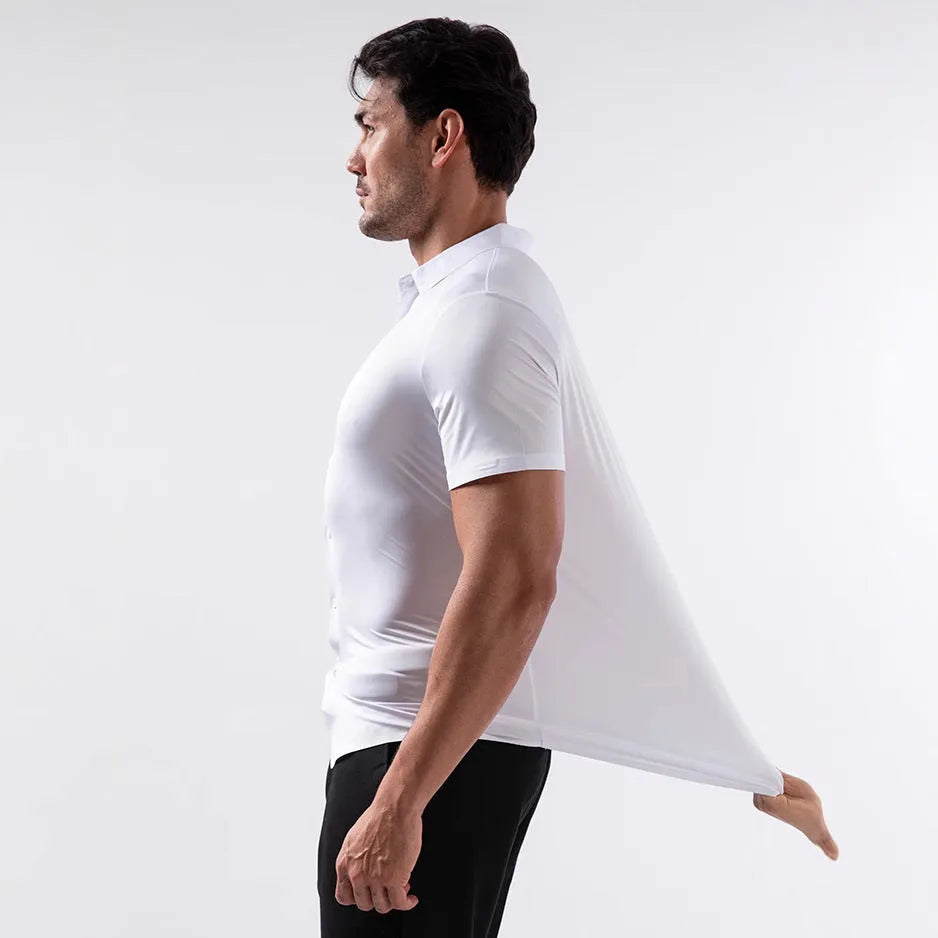Man wearing a grey short sleeve cardigan-style shirt with four-side elastic, non-ironing fabric.
