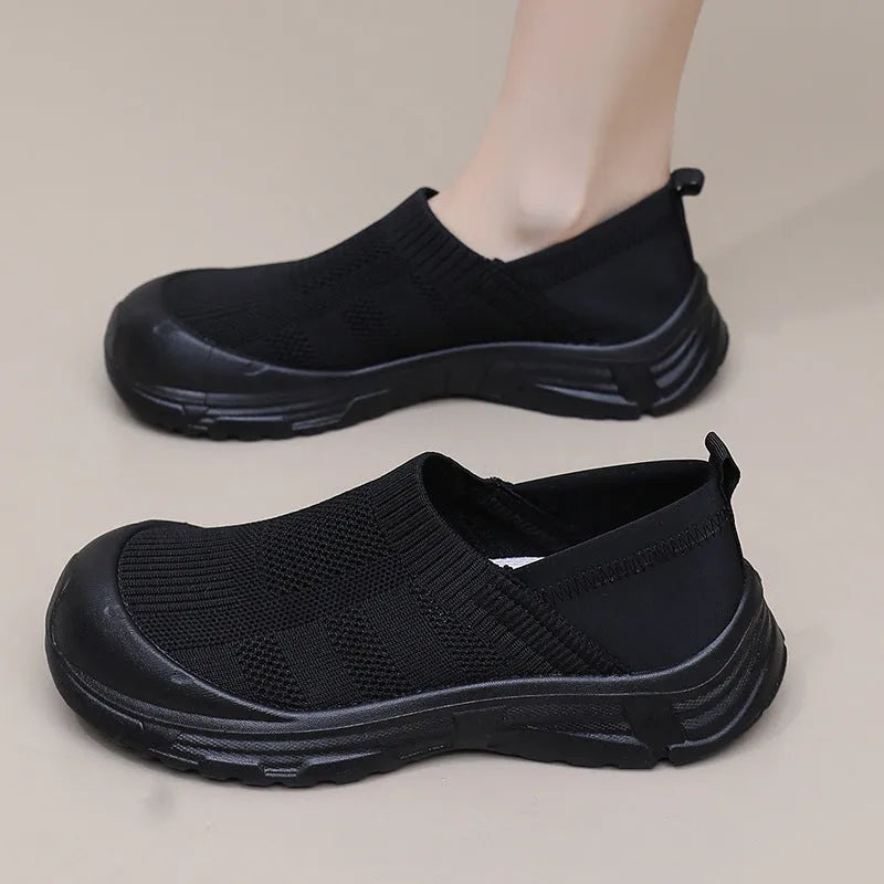 Women's black one pedal slip-on shoes with cloth upper and flat PVC sole