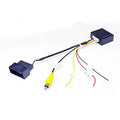 Black original car camera conversion box for Volkswagen and Skoda MIB hosts.