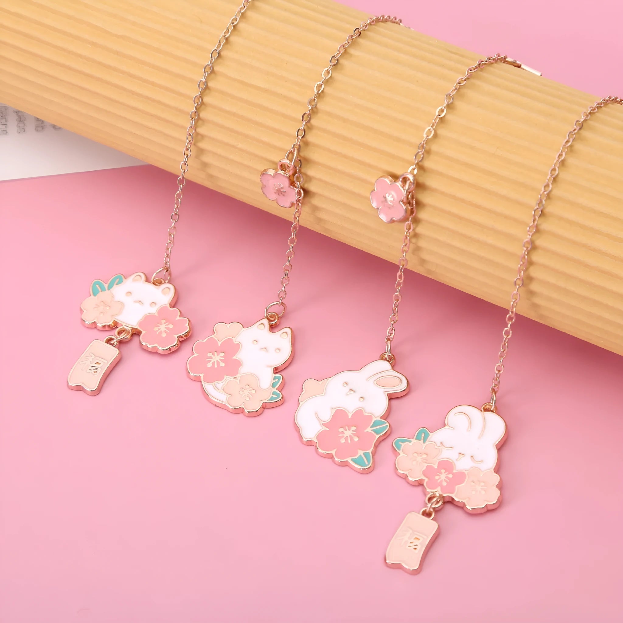 Creative cartoon metal pendant book holder with cherry blossom cat design for journal decoration.