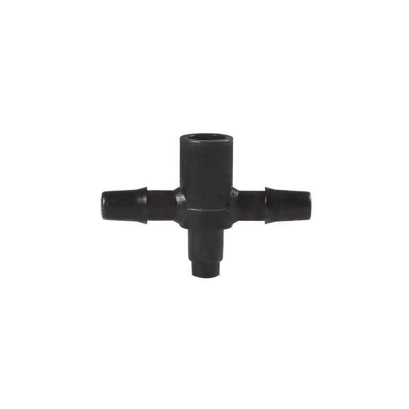Close-up of a black plastic tee joint water distributor for garden irrigation with three screw-thread outlets.