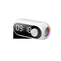 Black portable speaker with digital clock display showing time, USB cable connected, 10cm diameter size