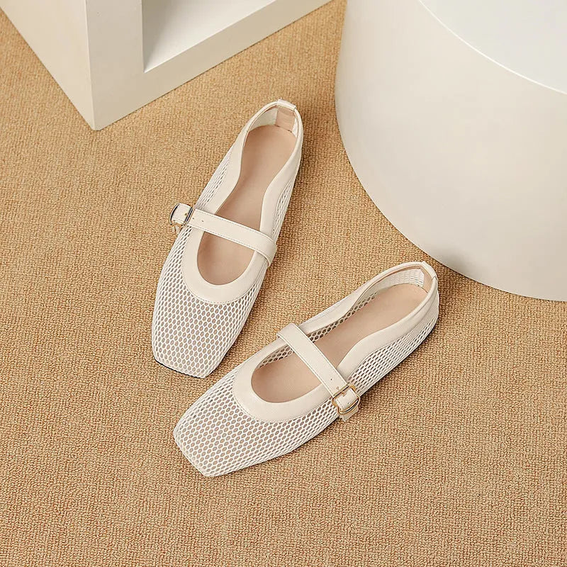 Women's beige mesh summer hiking pumps with a buckle and flat heel on a plain background.