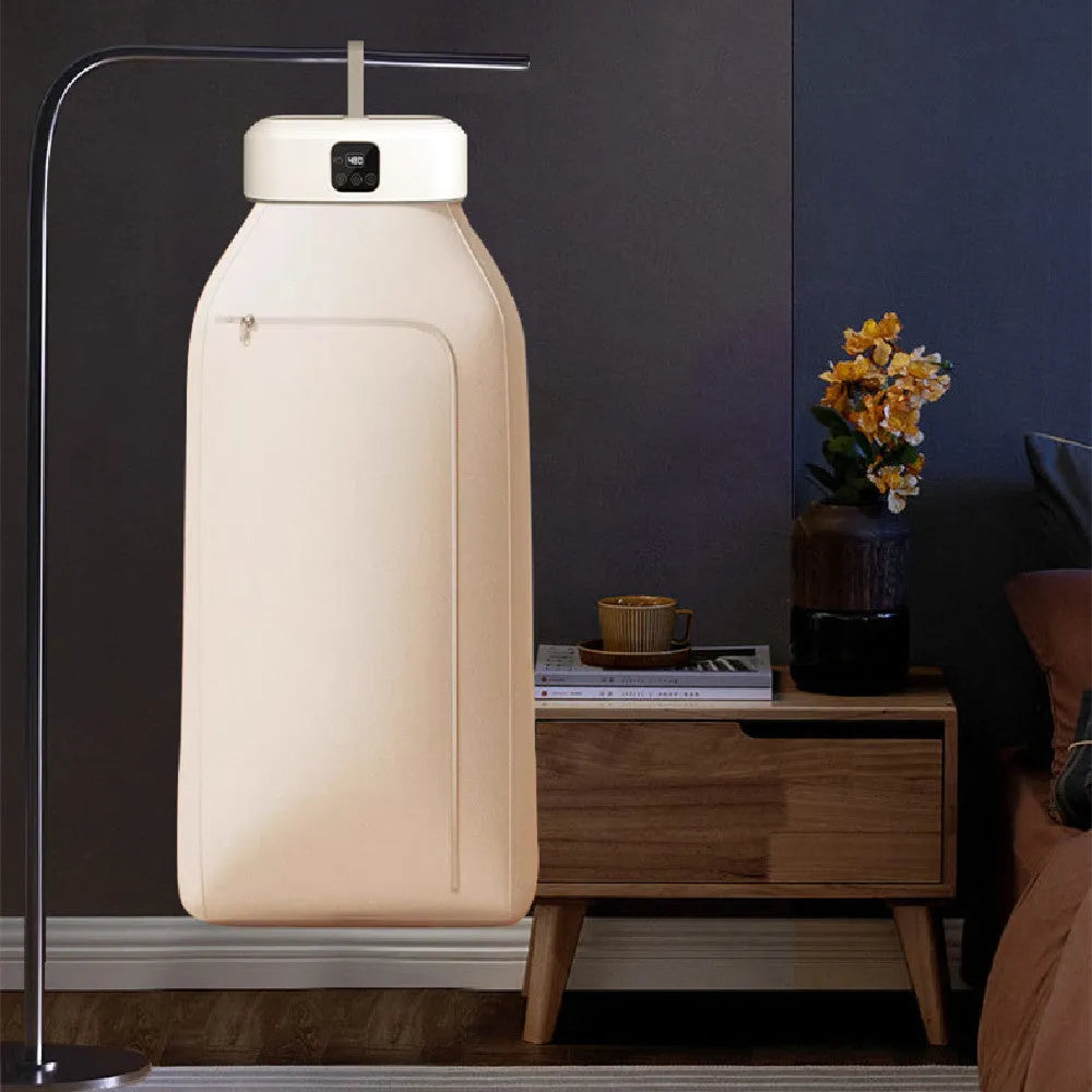 White cylindrical compact laundry dryer with remote control, dimensions 29 × 22 × 10cm, foldable for storage