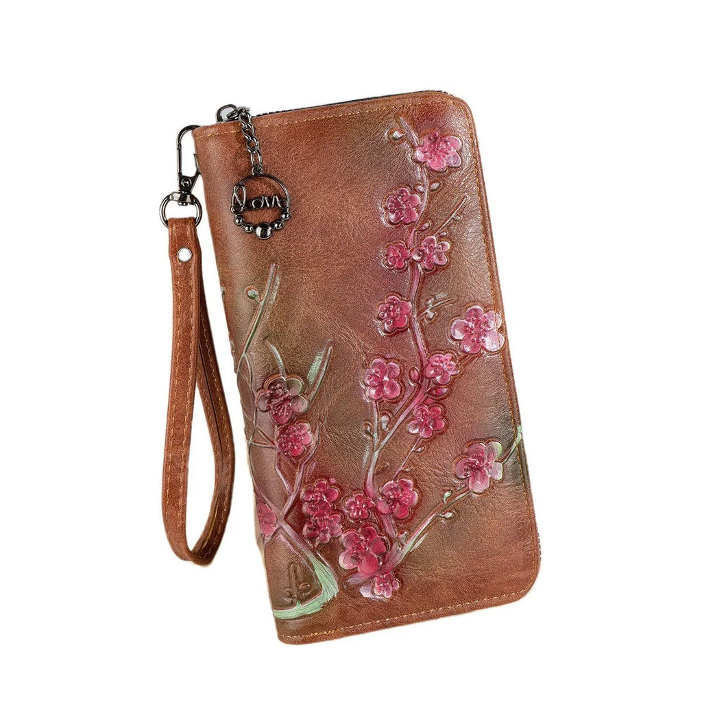 Embossed and hand-painted floral pattern on a brown Chinese-style zipper handbag.