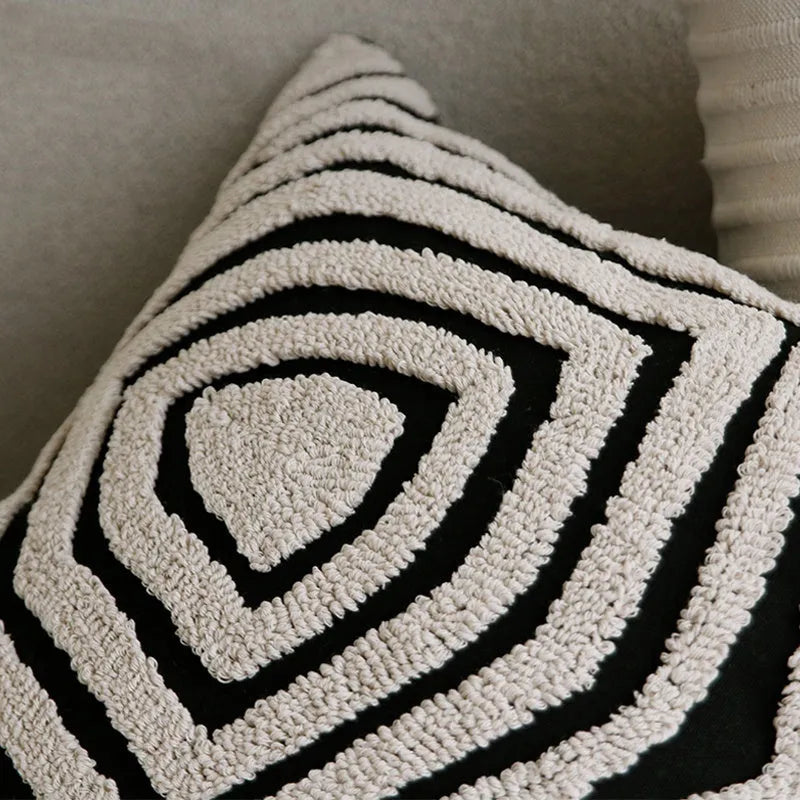 Black and white geometric patterned square and waist living room cushions with towel embroidery.