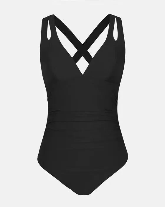 Solid colour one-piece triangle bikini swimsuit with cross shoulder straps on a model.