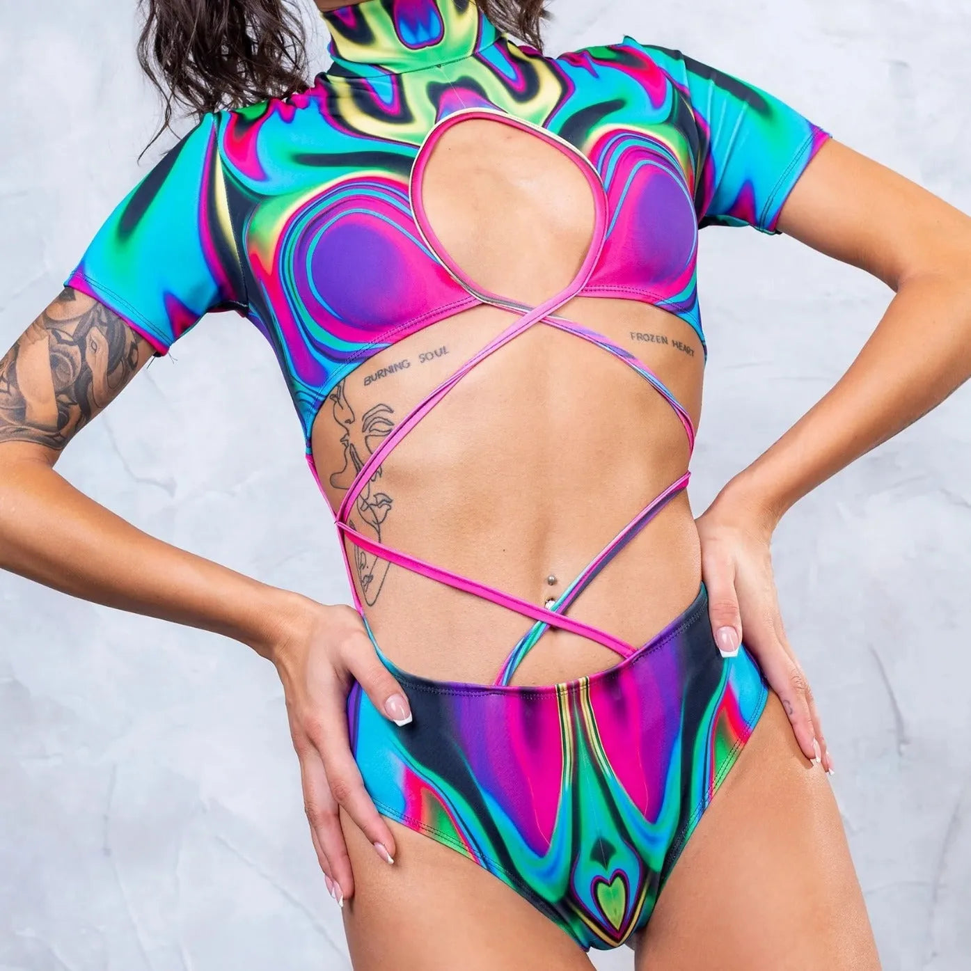 Long sleeve one-piece swimsuit with a high collar tie fastening in a solid colour.