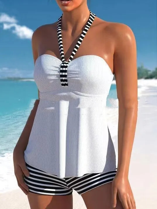 Women's black and white striped off-shoulder swimsuit on a mannequin.