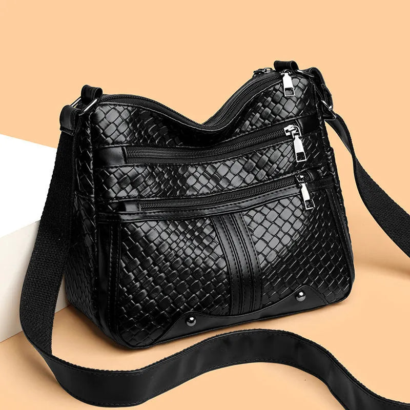 Woven PU messenger bag with horizontal square shape showing multiple compartments and internal zipper change pocket