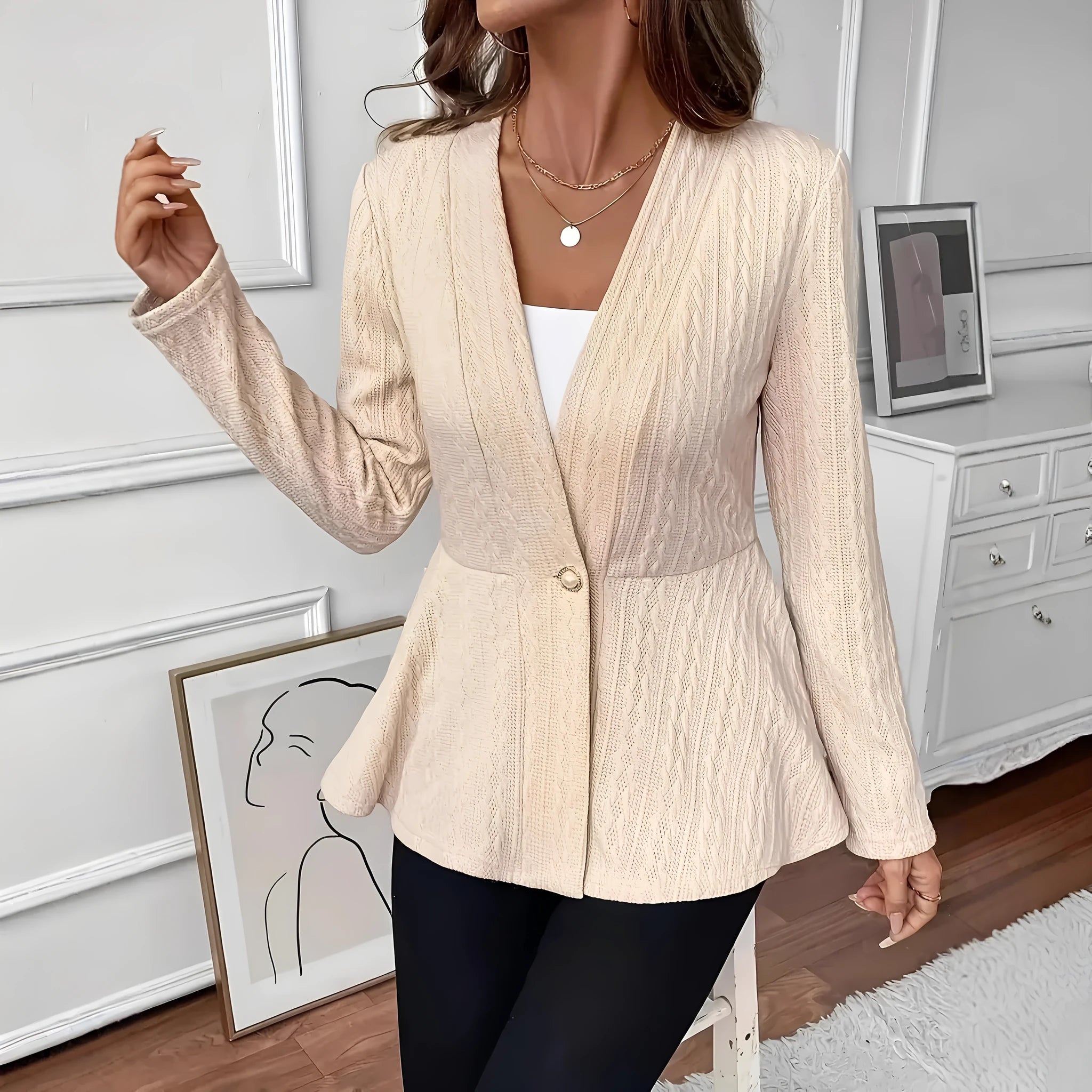 Women's apricot coloured Jacquard patterned knitted cardigan with single button front closure