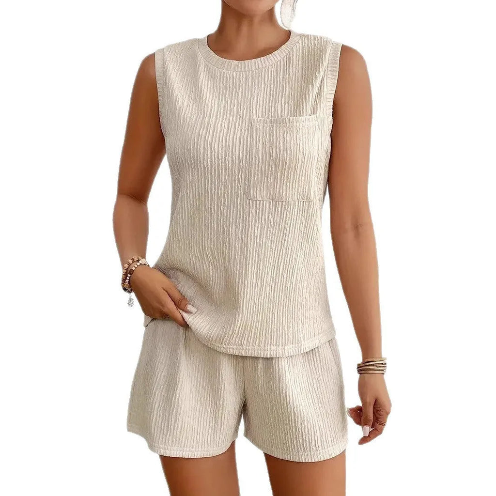 Solid colour sleeveless round neck vest and shorts set in apricot or orange, made from 100% polyester with S to XXL sizing options.