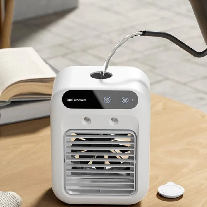 Ivory white portable USB air cooler with water tank and touchscreen controls on desk